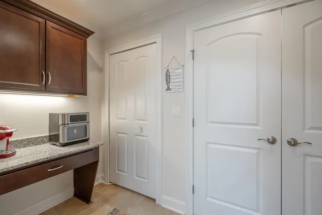 a kitchen with cabinets and stainless steel appliances