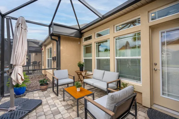 a outdoor space with patio the couches and a potted plant on the table
