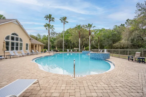 a view of a swimming pool with a patio