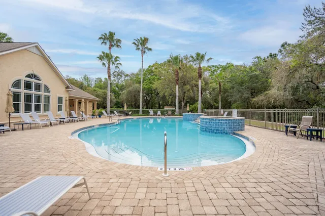 a view of a swimming pool with a patio