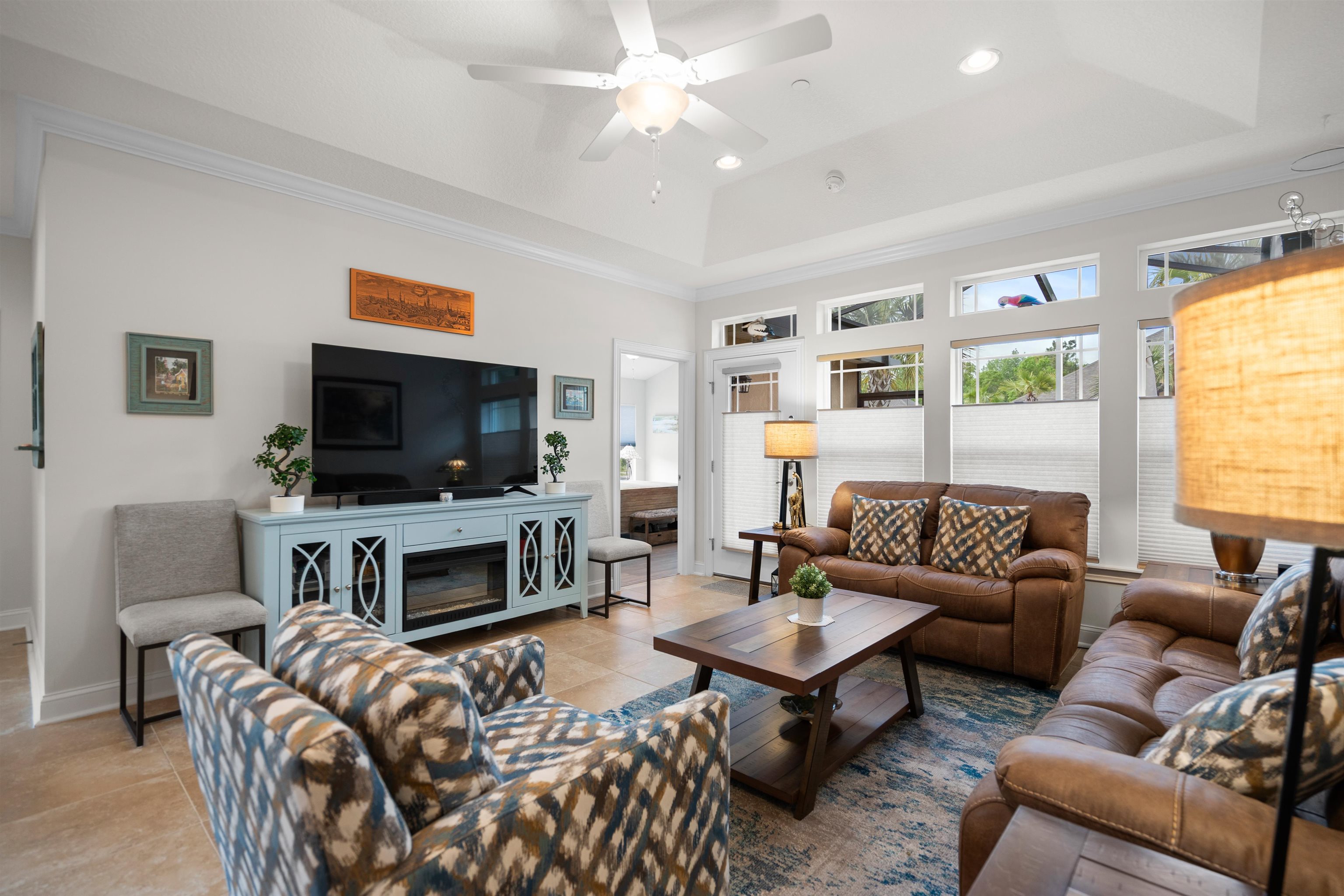 102 Timoga Trail St. Augustine, FL 32084 - Photo 8 of 44 a living room with furniture a flat screen tv and a fireplace