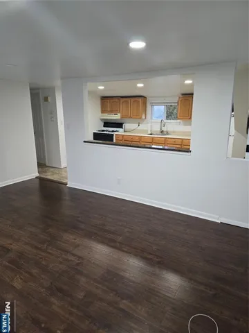 a view of kitchen with wooden floor