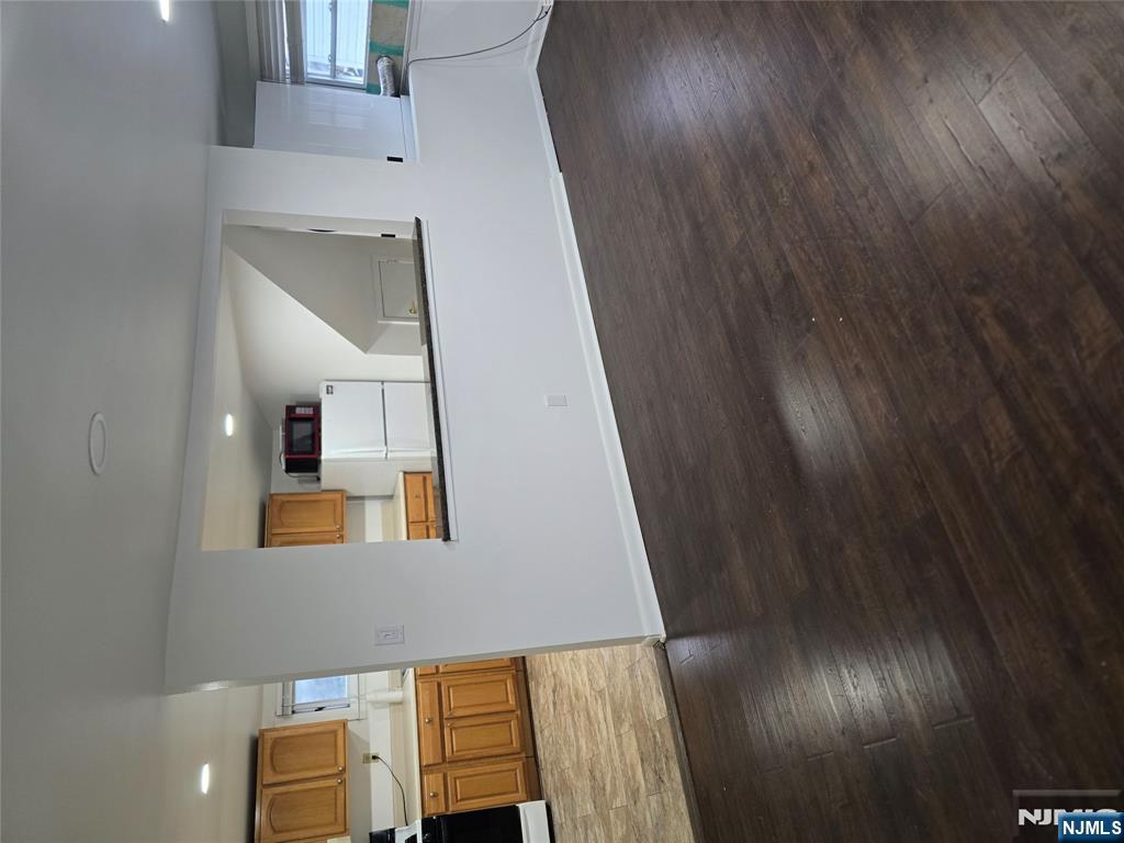18 Donna Drive, Unit 2 Wood-Ridge, NJ 07075 - Photo 13 of 15 a view of a kitchen with wooden floor and a sink