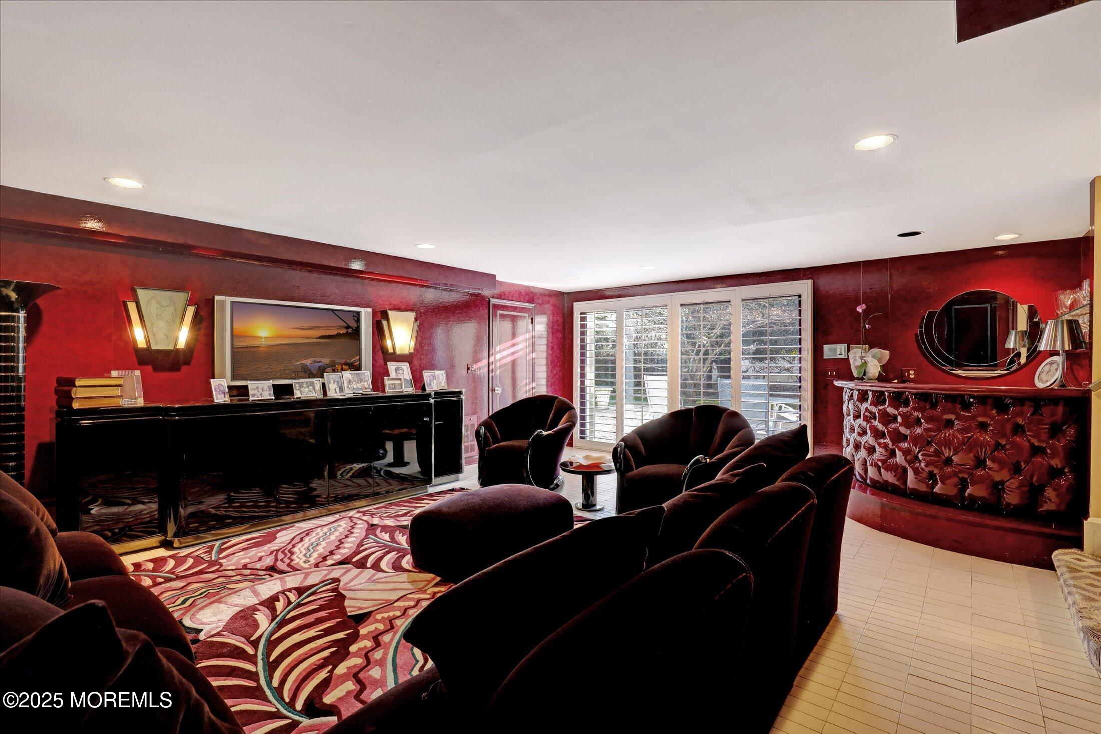 12 Woodford Road Deal, NJ 07723 - Photo 25 of 77 a living room with furniture a lamp and a fireplace