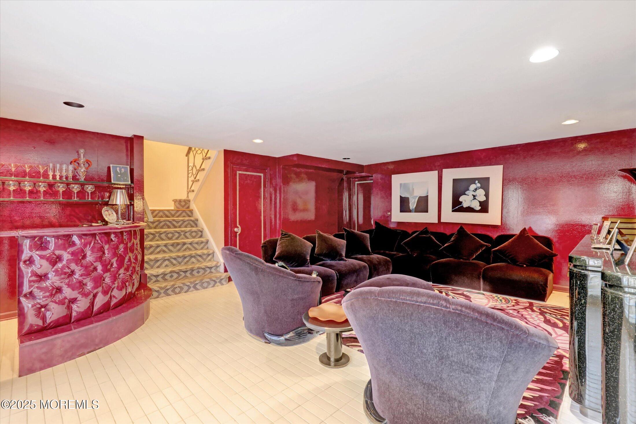 12 Woodford Road Deal, NJ 07723 - Photo 26 of 77 a living room with furniture three lamp and a fireplace