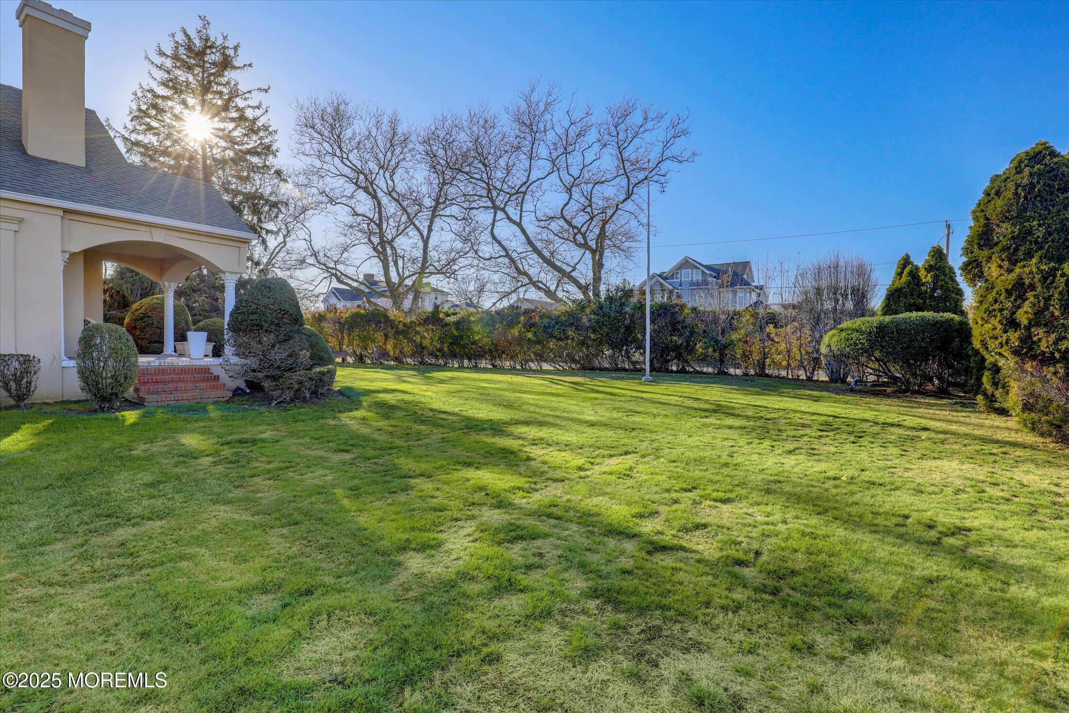 12 Woodford Road Deal, NJ 07723 - Photo 58 of 77 a view of a garden with large trees