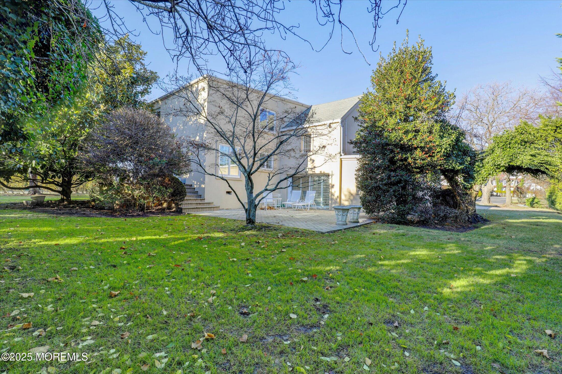 12 Woodford Road Deal, NJ 07723 - Photo 59 of 77 a view of backyard with tree