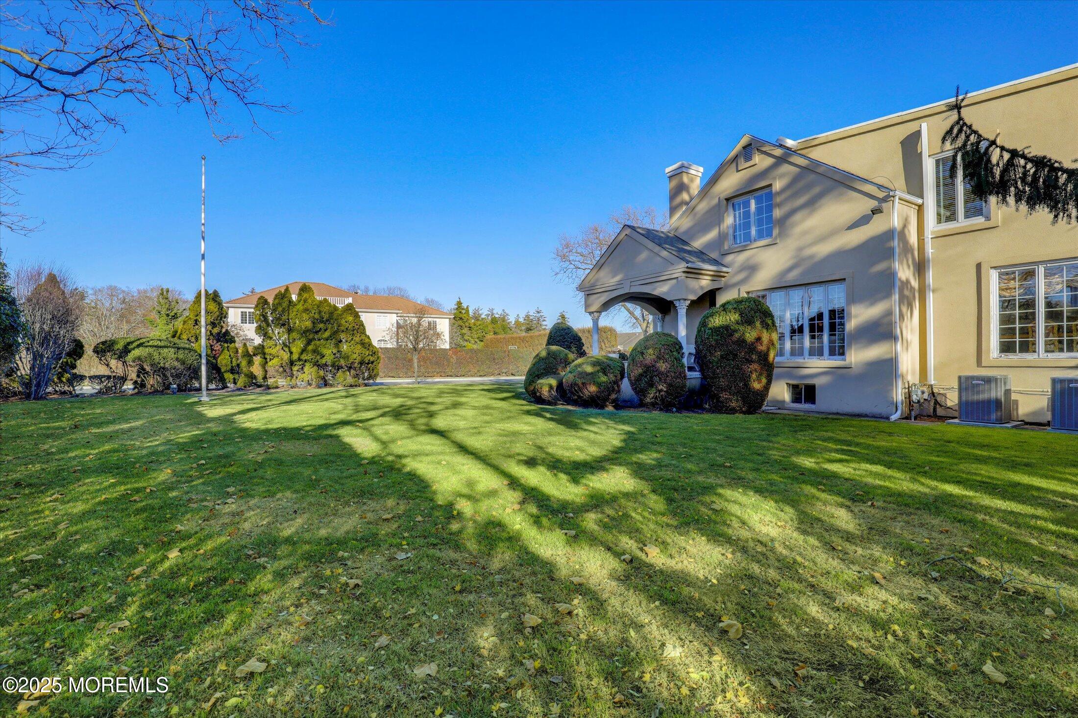 12 Woodford Road Deal, NJ 07723 - Photo 76 of 77 a view of a house with a big yard