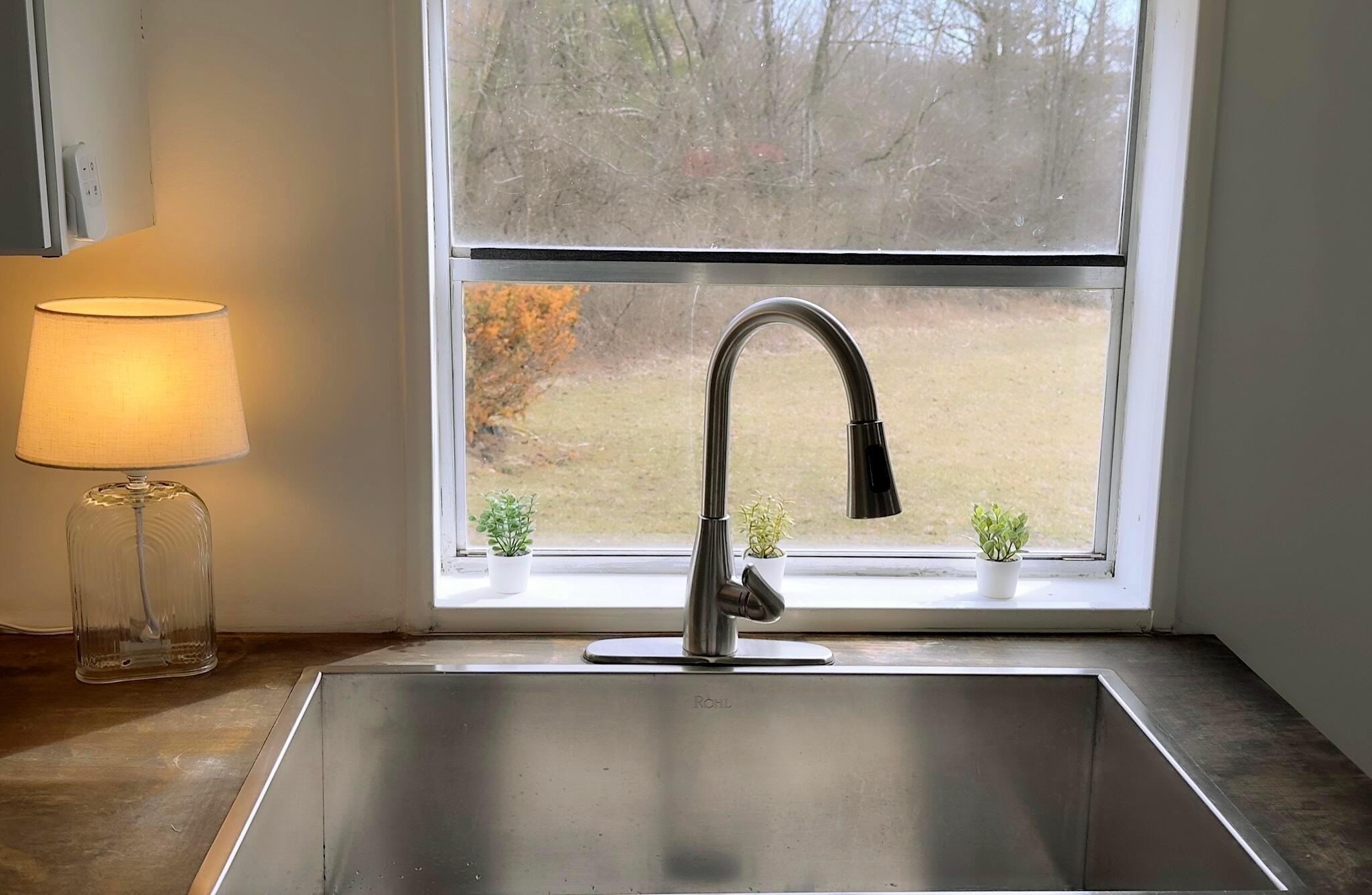 1330 Hanover Road, Unit 33 Delaware, OH 43015 - Photo 8 of 29 Kitchen sink overlooking greenspace