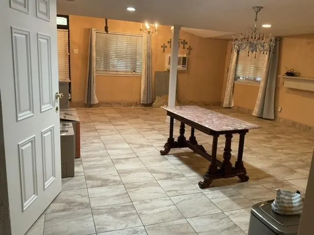 a spacious bathroom with a granite countertop sink a mirror and a shower