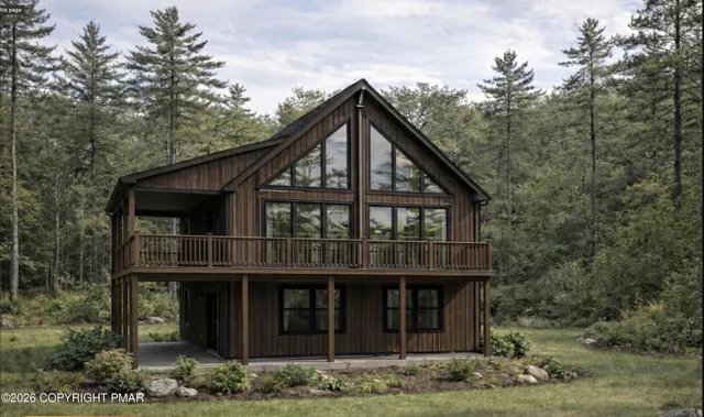 a view of a house with a yard and balcony