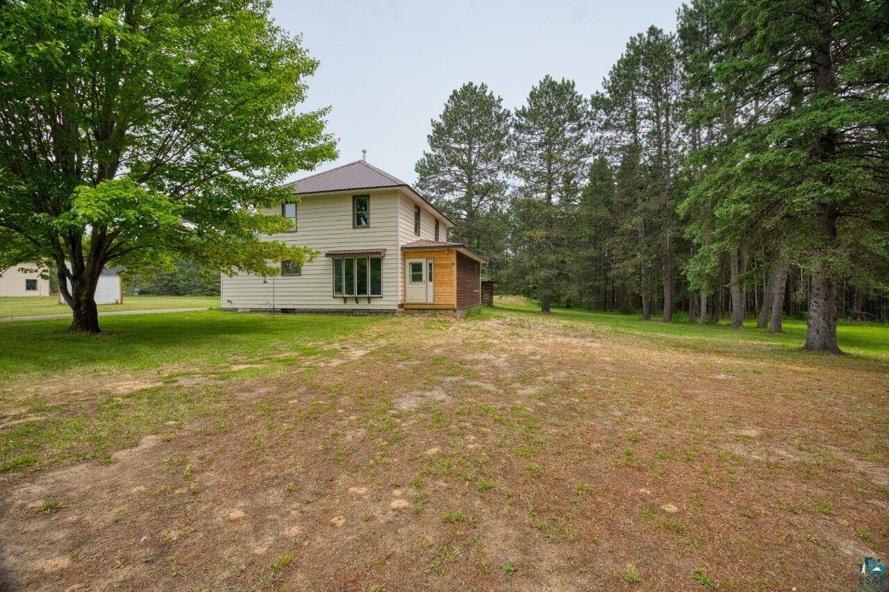 4755 Judd Road Gilbert, MN 55741 - Photo 41 of 50 Rear view of property featuring a yard, metal roof, and crawl space