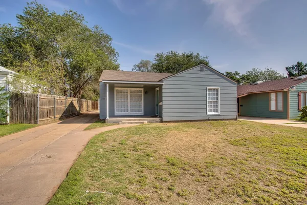 front view of a house with a yard