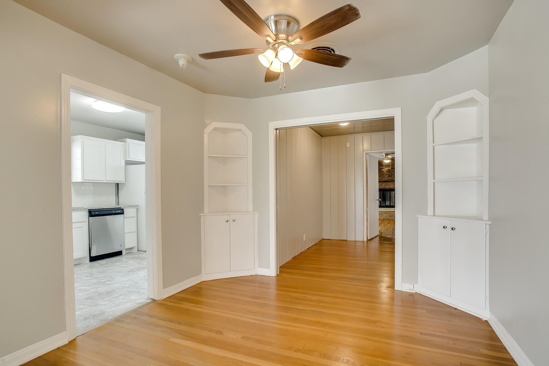 2412 22nd Street Lubbock, TX 79411 - Photo 6 of 18 a view of a room with wooden floor and a ceiling fan