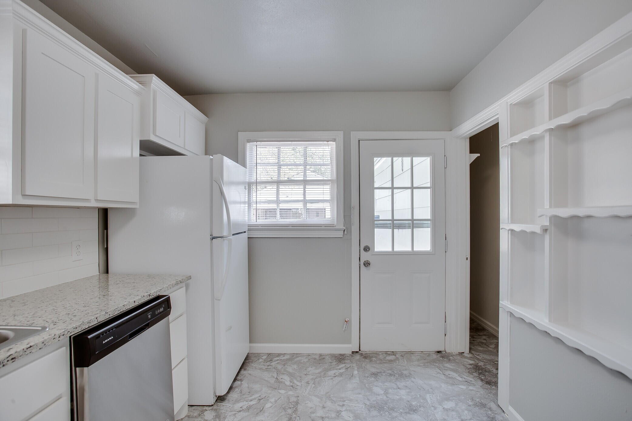 2412 22nd Street Lubbock, TX 79411 - Photo 8 of 18 an empty room with windows