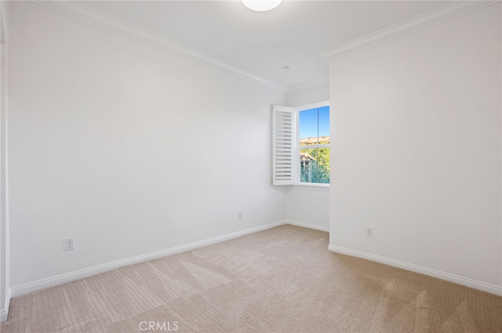 121 Danbrook Irvine, CA 92603 - Photo 14 of 16 an empty room with a window