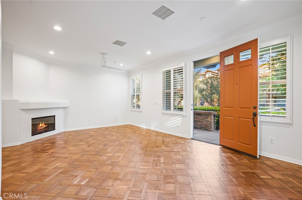 121 Danbrook Irvine, CA 92603 - Photo 2 of 16 a view of an empty room with a fireplace and a window