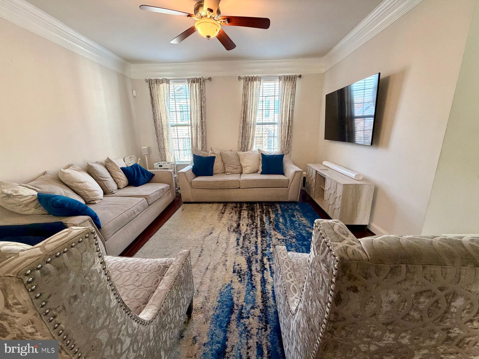 4502 Potomac Highlands Circle Triangle, VA 22172 - Photo 2 of 5 a living room with furniture and a flat screen tv