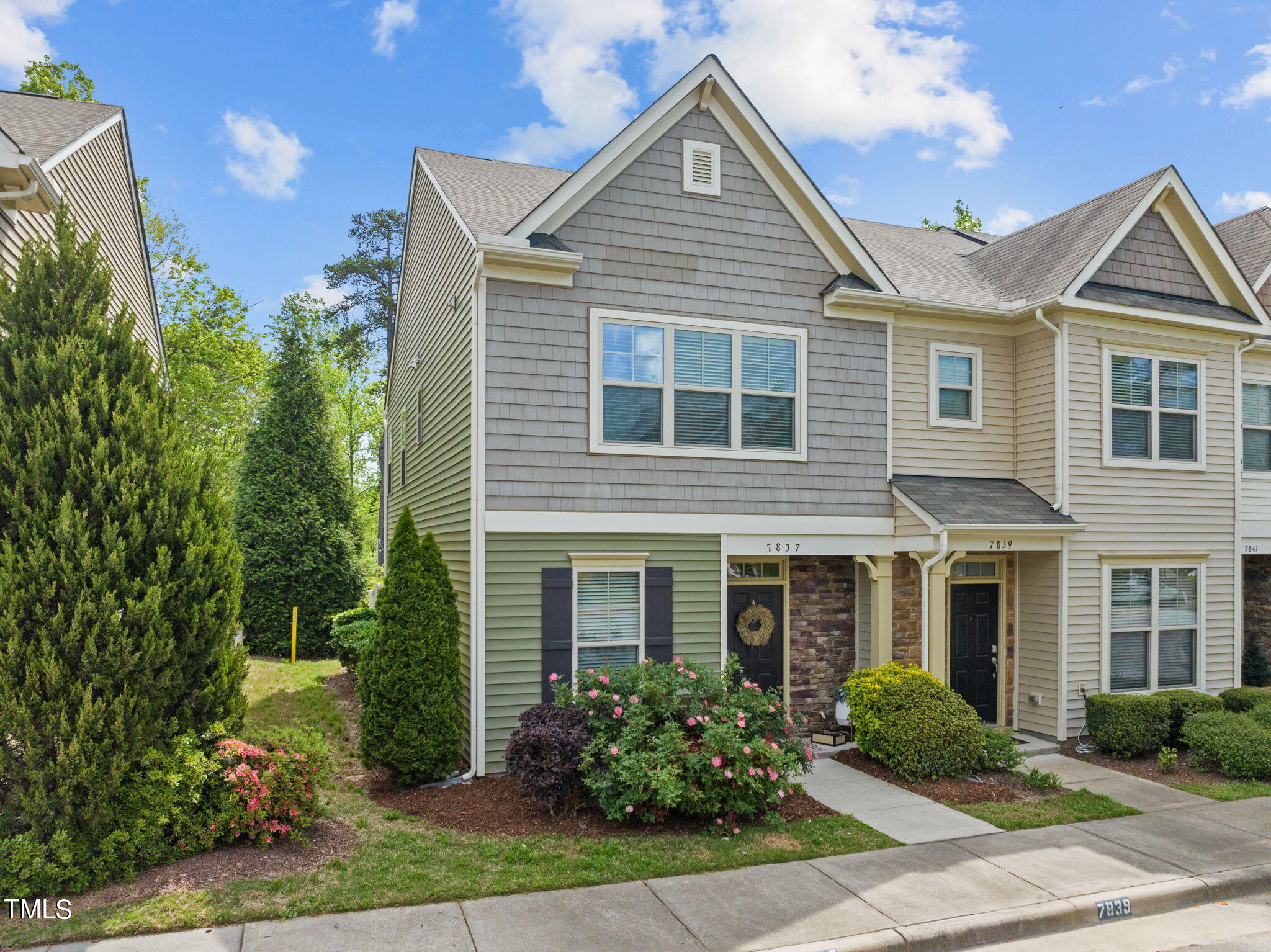 7837 Allscott Way Raleigh, NC 27612 - Photo 1 of 17 a front view of a house with garden