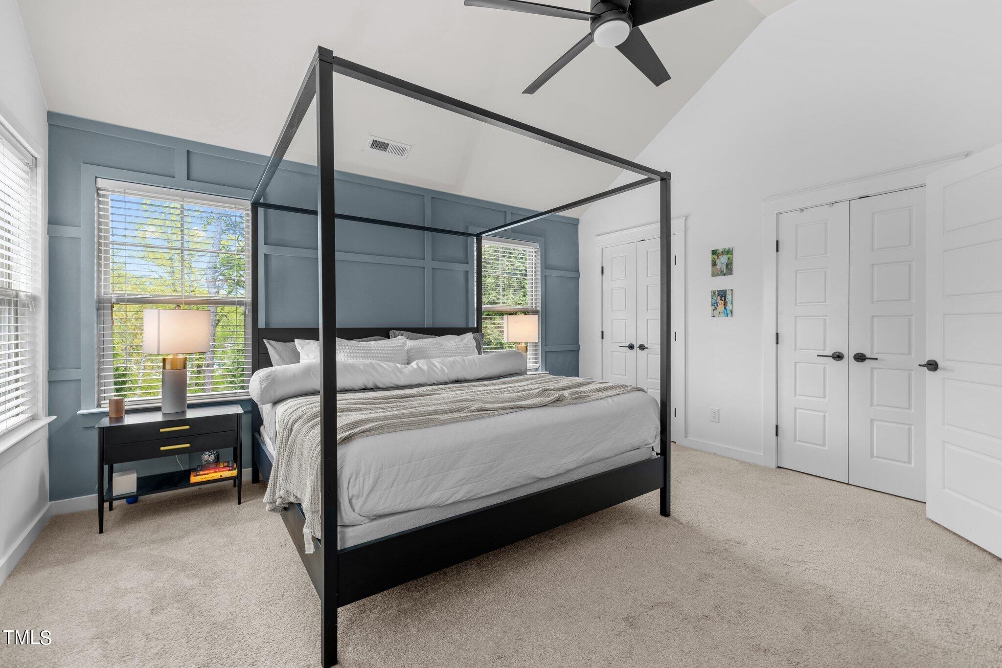 7837 Allscott Way Raleigh, NC 27612 - Photo 11 of 17 a bedroom with a bed a table and painting