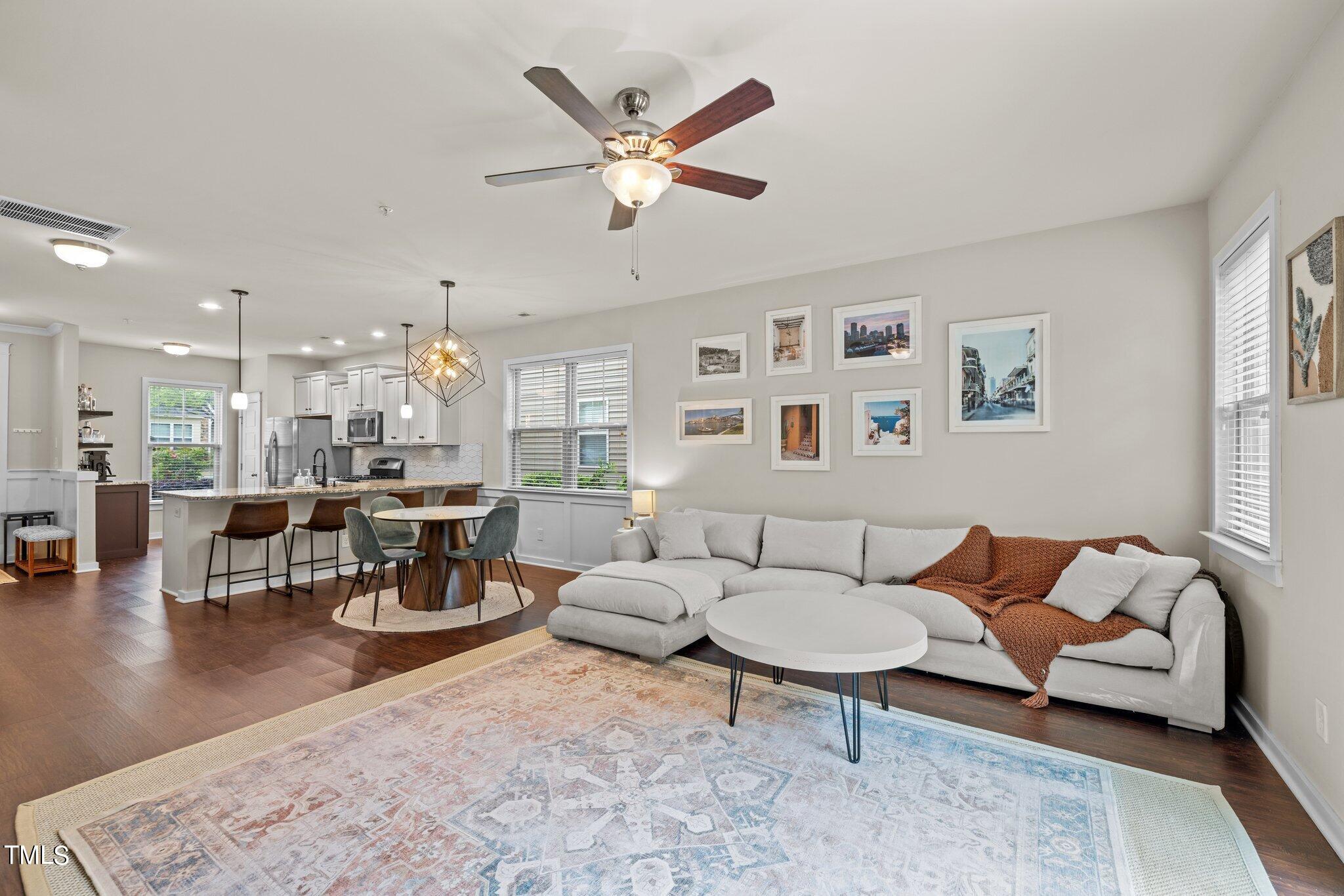 7837 Allscott Way Raleigh, NC 27612 - Photo 7 of 17 a living room with furniture kitchen view and a window