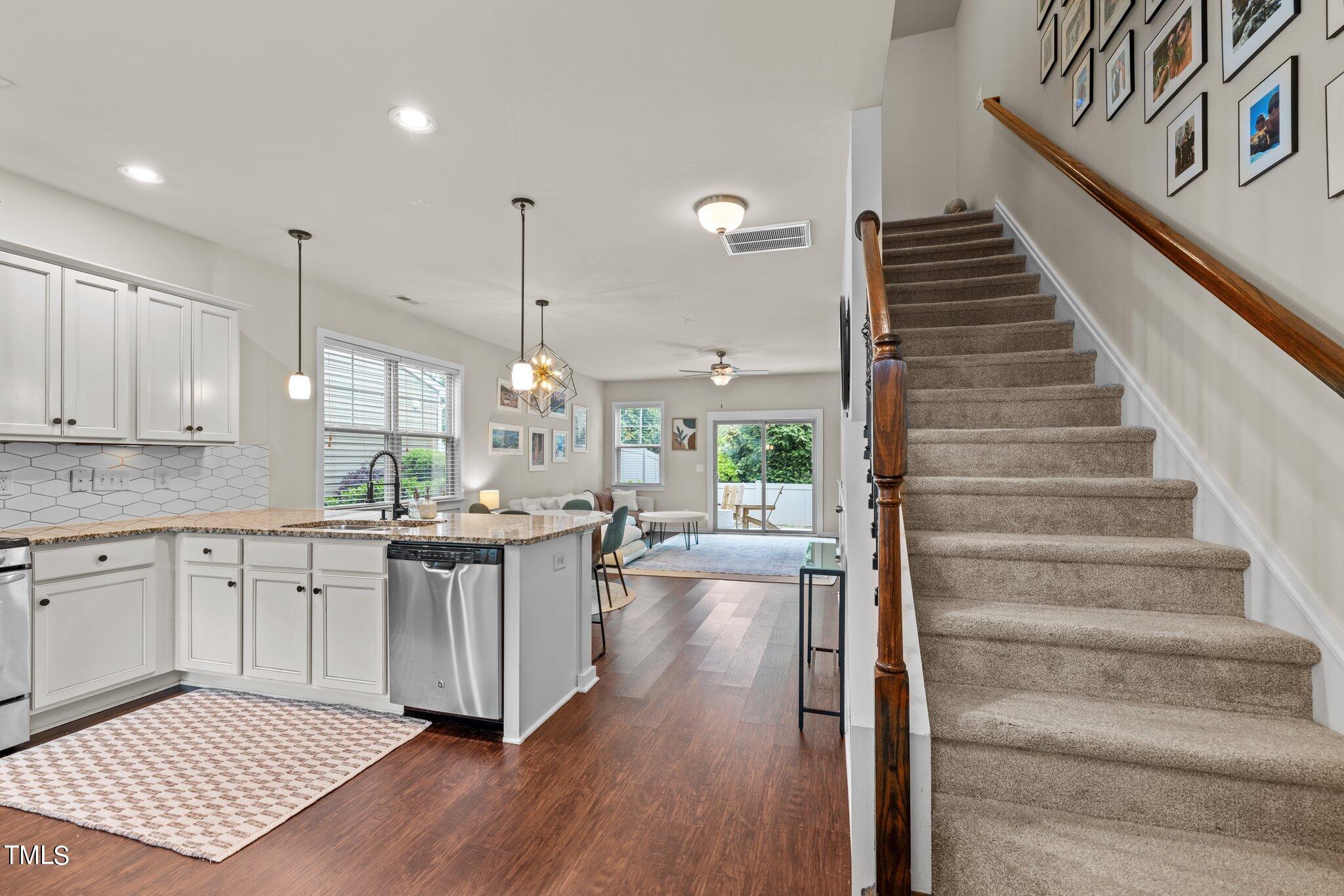 7837 Allscott Way Raleigh, NC 27612 - Photo 10 of 17 a kitchen with sink and wooden floor