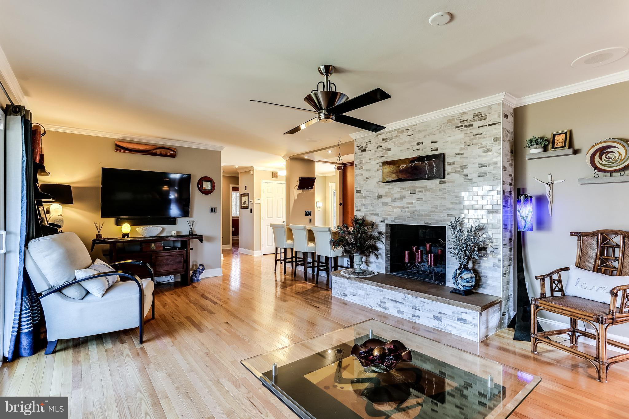 6412 Lochridge Road Columbia, MD 21044 - Photo 6 of 53 Living Room & Adjoining Kitchen with Bar Seating