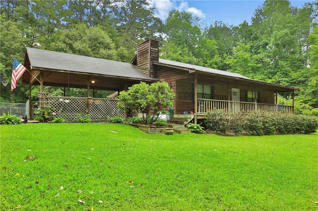 625 Punkintown Road Villa Rica, GA 30180 - Photo 1 of 1 a front view of a house with garden