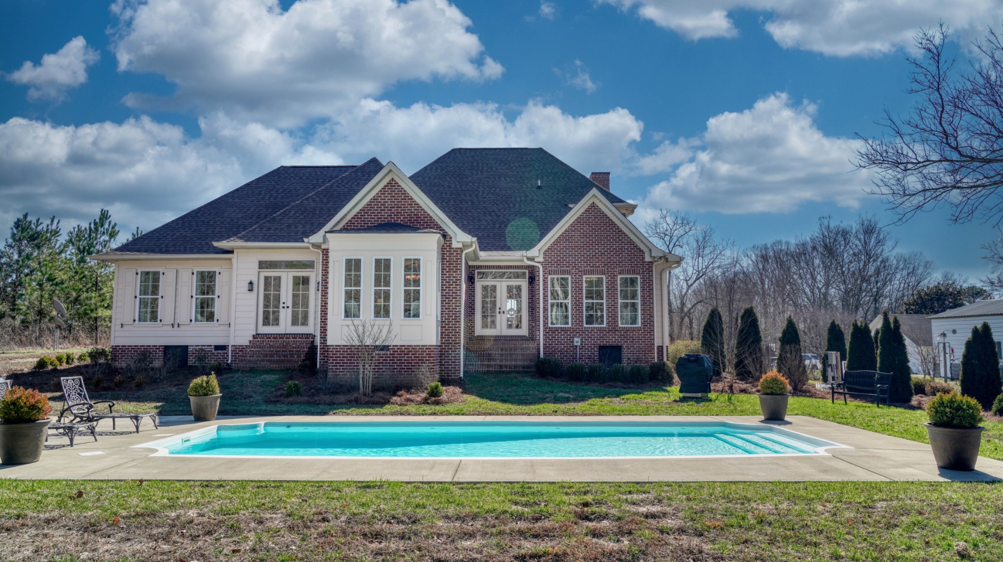 1368 Tidwell Switch Road Dickson, TN 37055 - Photo 54 of 69 a front view of a house with a yard table and chairs