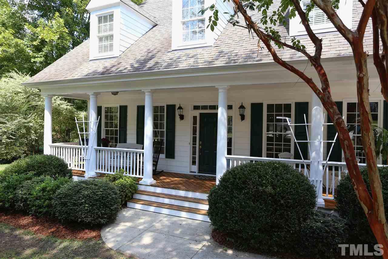 202 Manor Ridge Road Carrboro, NC 27510 - Photo 2 of 25 a view of a house with potted plants and a large tree