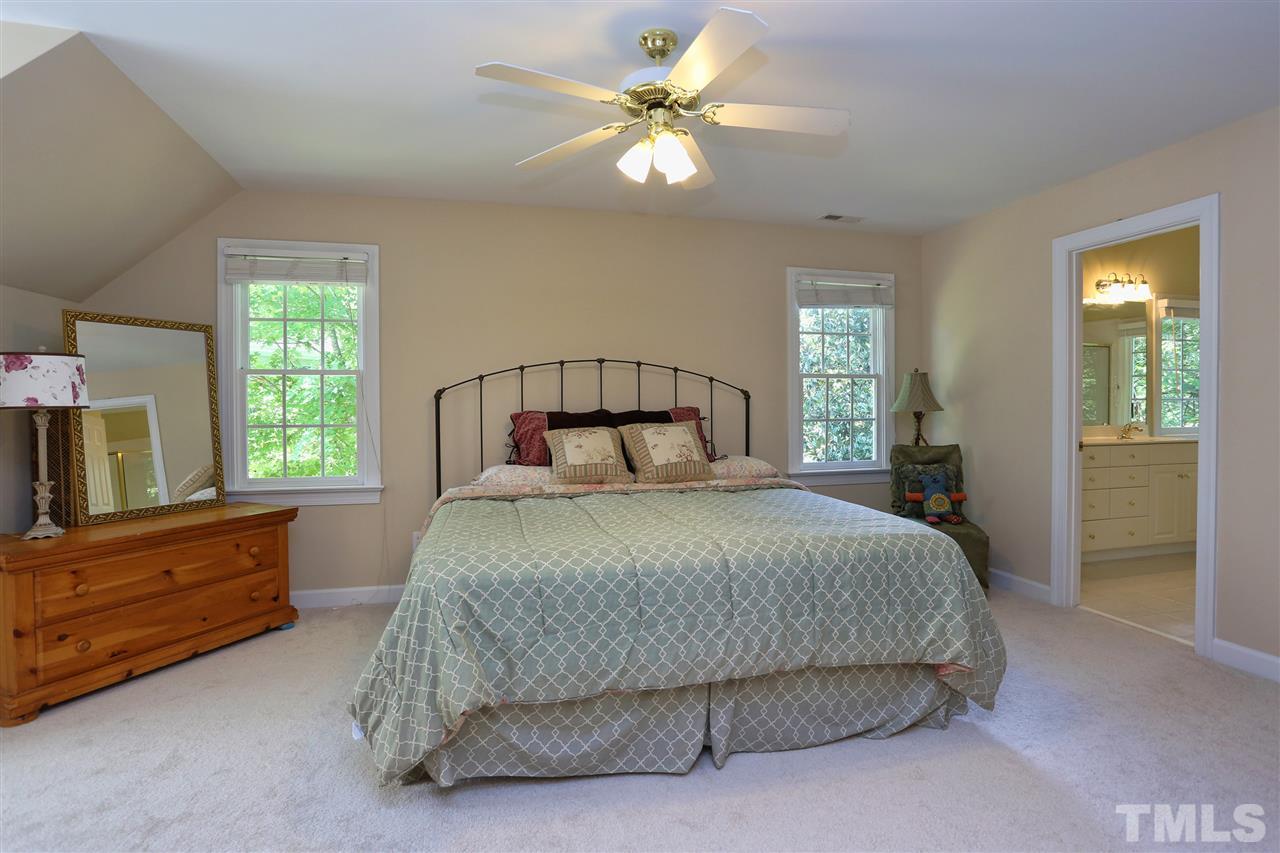 202 Manor Ridge Road Carrboro, NC 27510 - Photo 11 of 25 a bedroom with a bed and window