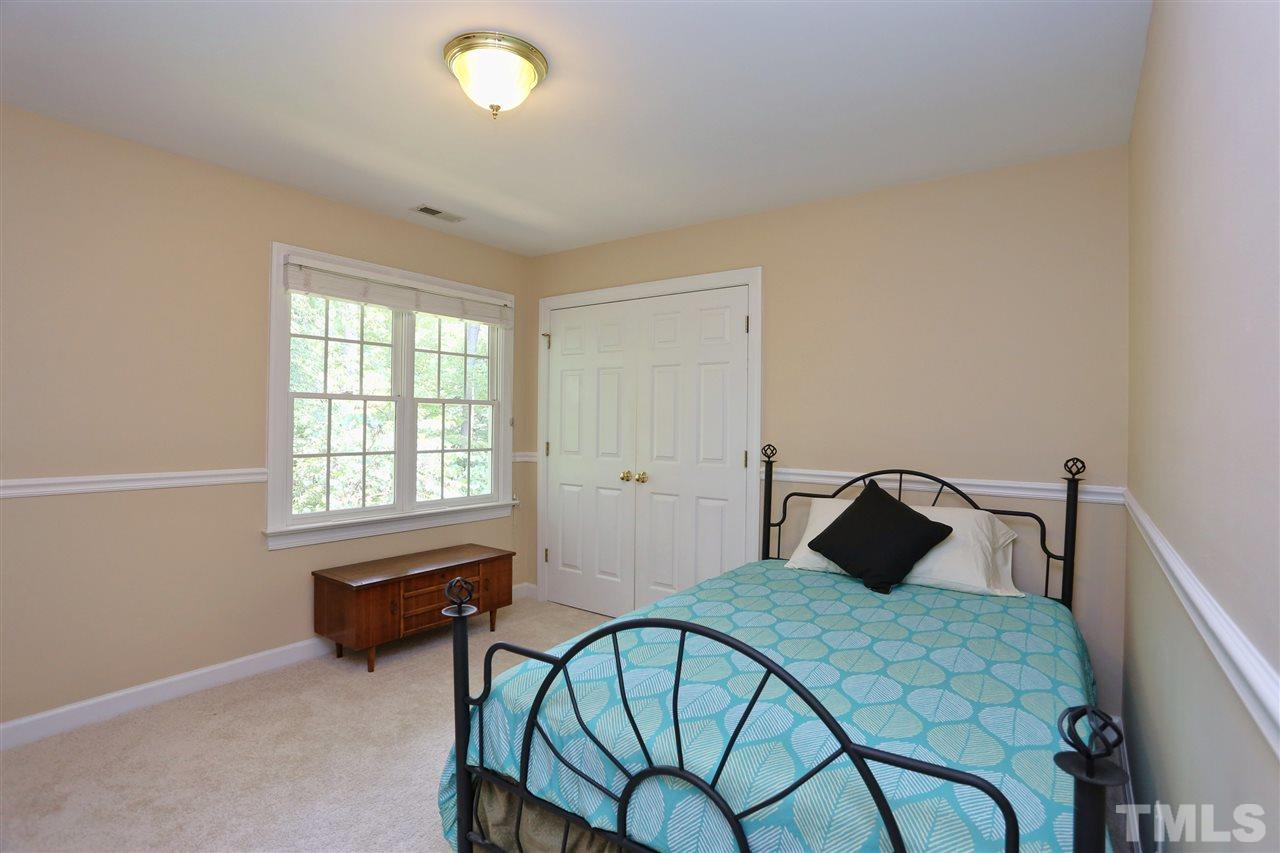202 Manor Ridge Road Carrboro, NC 27510 - Photo 13 of 25 a bedroom with a bed and a window