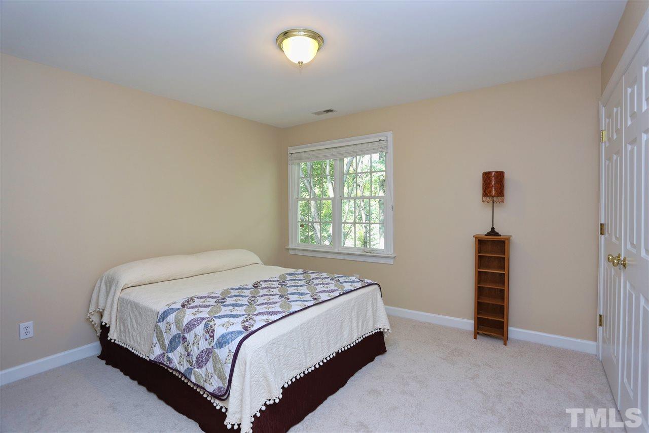 202 Manor Ridge Road Carrboro, NC 27510 - Photo 14 of 25 a bedroom with a bed and a window