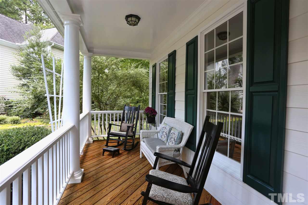 202 Manor Ridge Road Carrboro, NC 27510 - Photo 3 of 25 a view of a balcony with chair and wooden floor