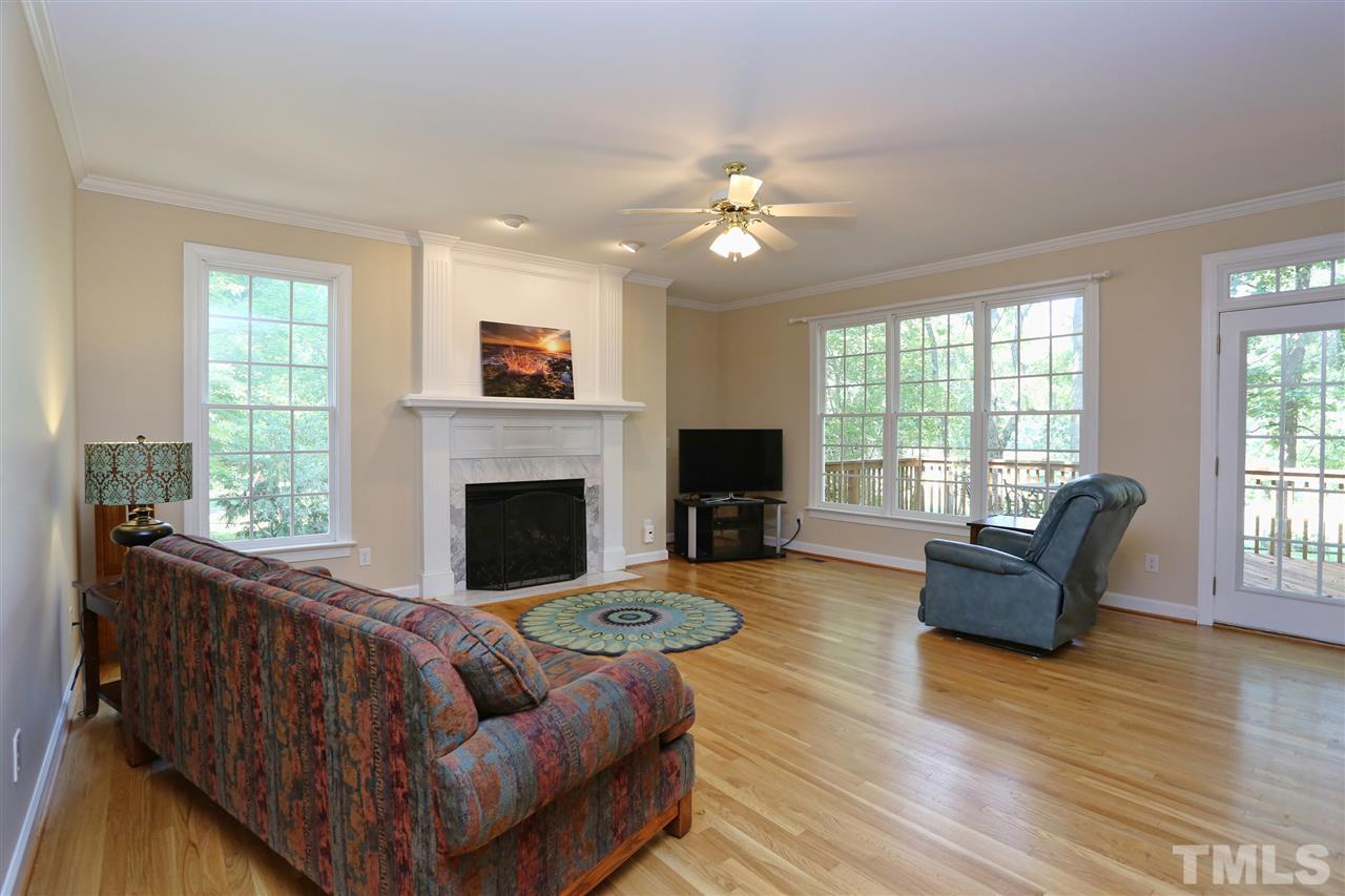 202 Manor Ridge Road Carrboro, NC 27510 - Photo 4 of 25 a living room with furniture and a fireplace