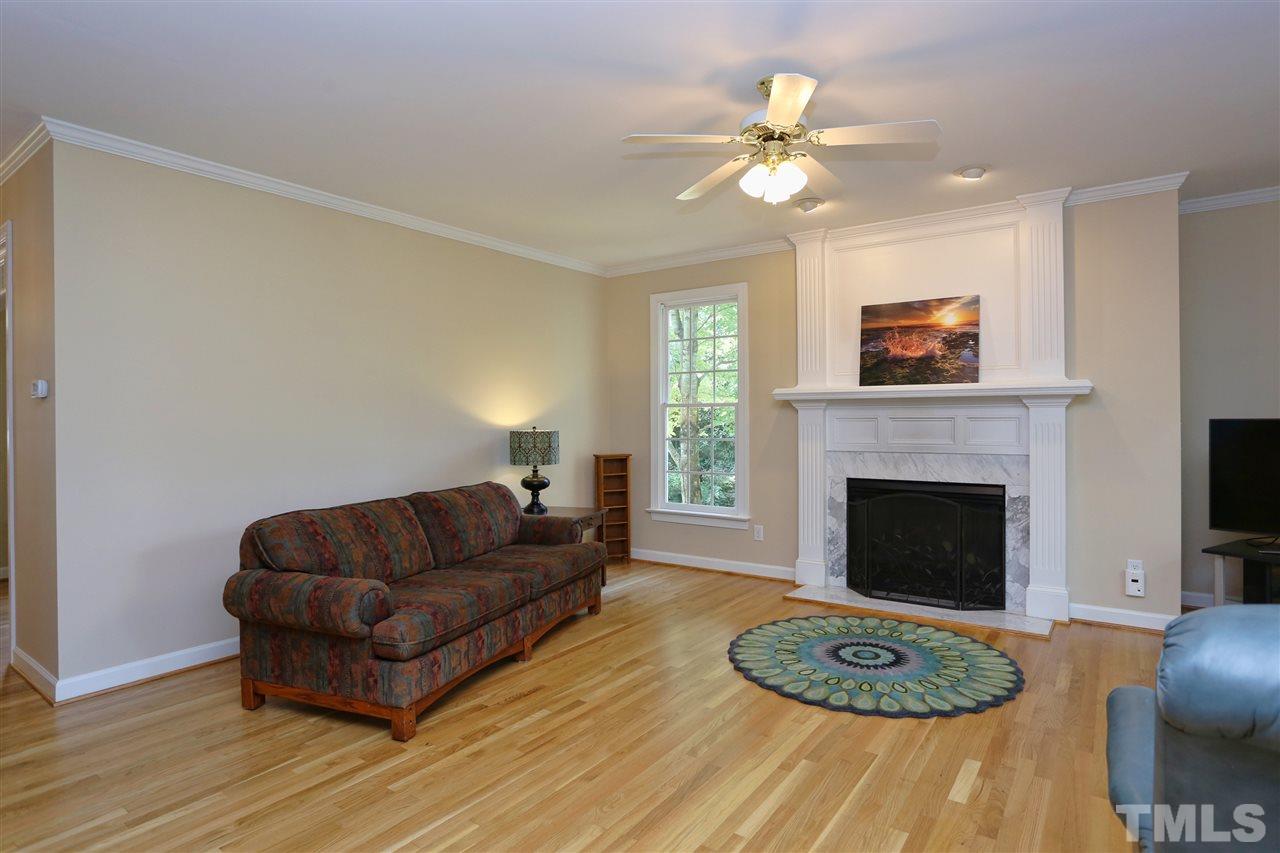 202 Manor Ridge Road Carrboro, NC 27510 - Photo 5 of 25 a living room with furniture and a fireplace