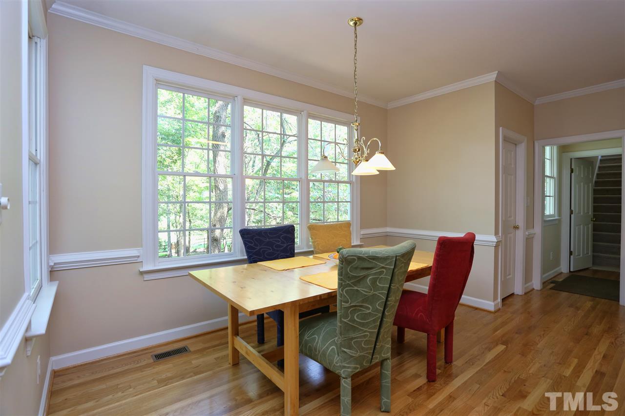 202 Manor Ridge Road Carrboro, NC 27510 - Photo 8 of 25 a view of a dining room with furniture window and wooden floor
