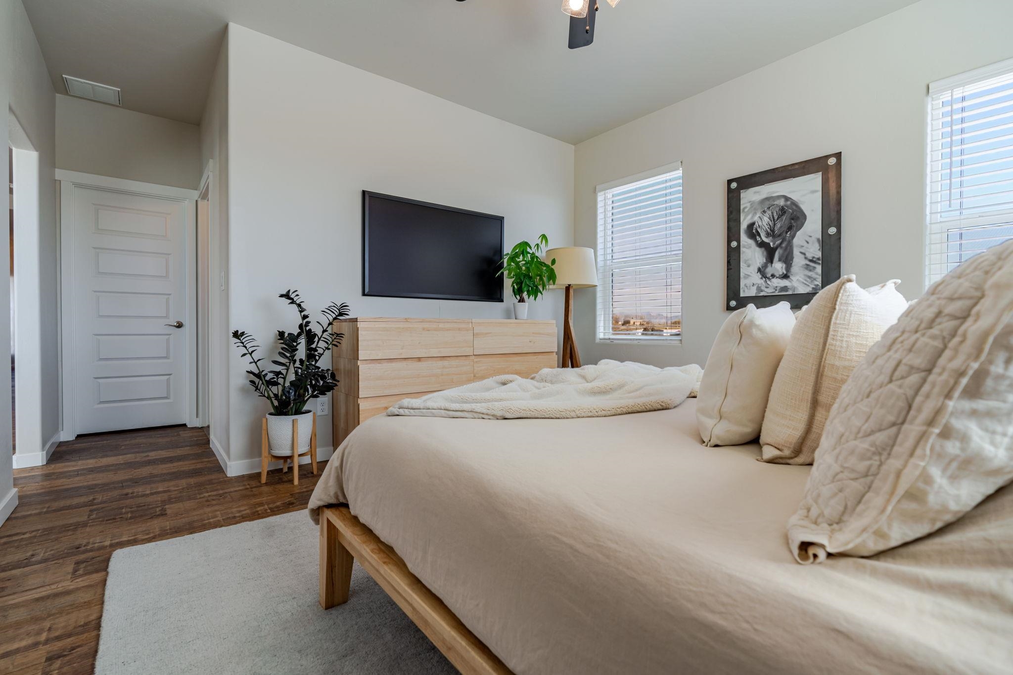 1301 M Road Loma, CO 81524 - Photo 13 of 32 a bedroom with bed and a flat screen tv