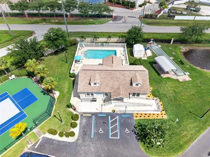an aerial view of residential houses with outdoor space