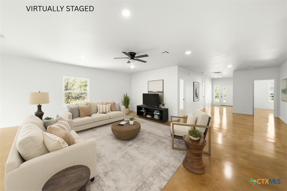 5165 Comanche Drive Temple, TX 76502 - Photo 29 of 41 a living room with furniture and a wooden floor