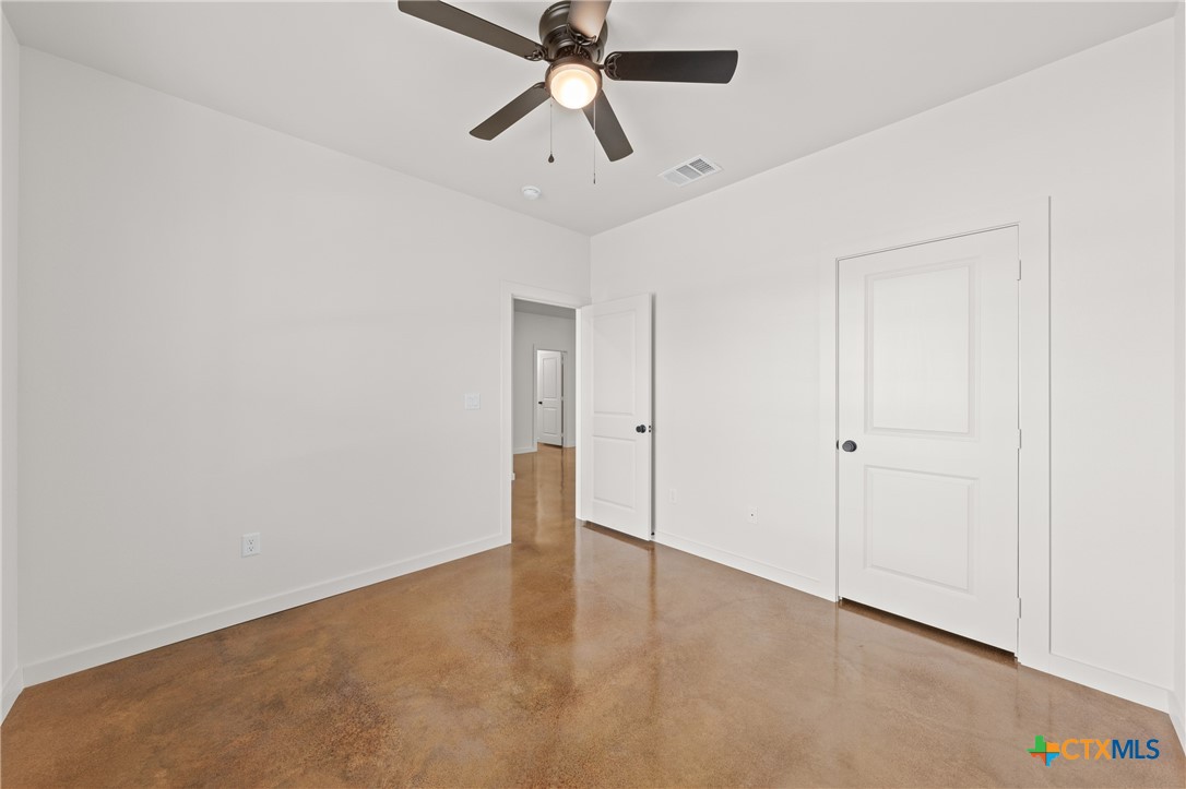 5165 Comanche Drive Temple, TX 76502 - Photo 10 of 41 an empty room with chandelier fan