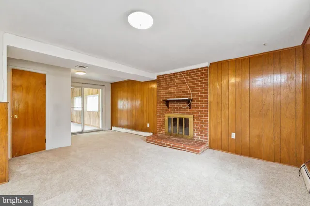 a view of an empty room with glass door