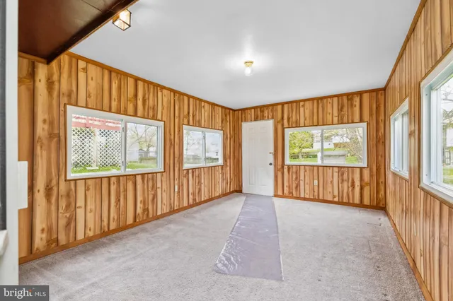 a view of an entryway with wooden floor