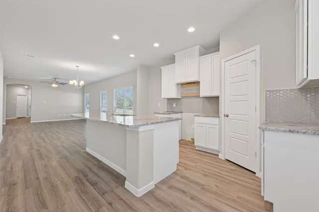 a view of an empty room with closet area