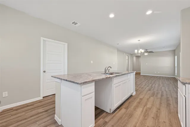 a bathroom with double vanity sinks and a shower
