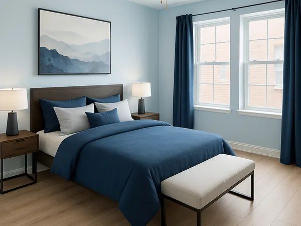 a bedroom with a bed and a painting on the wall
