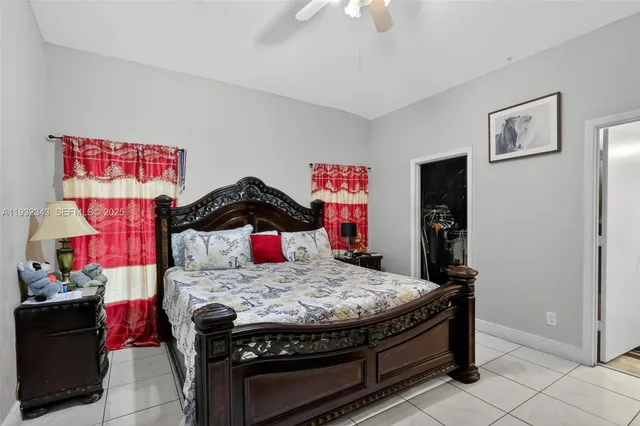 a bedroom with a bed and cabinets