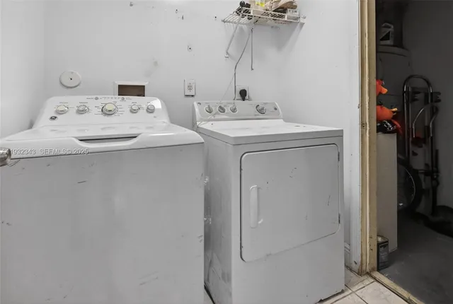 a bedroom with a bed and a view of kitchen