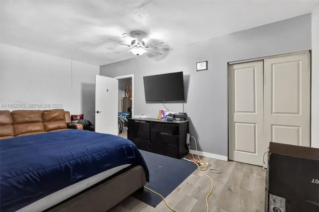 a bedroom with a bed and cabinets