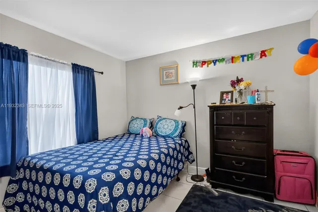 a bedroom with a bed and a closet